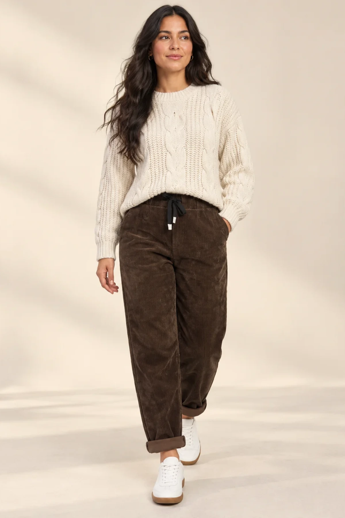 Model in brown cord trousers
