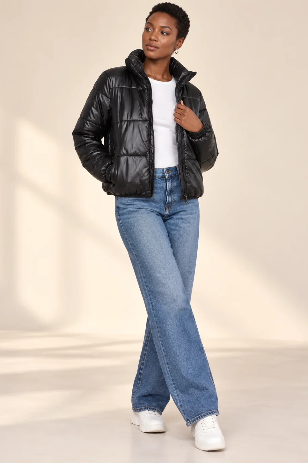 Model in a black quilted puffer jacket